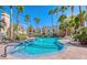 Inviting community pool surrounded by palm trees, offering a refreshing escape for residents to unwind and socialize at 3145 E Flamingo Rd # 1045, Las Vegas, NV 89121