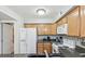 Bright kitchen boasts granite counters, white appliances, and convenient cabinet storage at 3145 E Flamingo Rd # 1045, Las Vegas, NV 89121