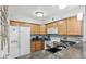 Well-lit kitchen with granite countertops, stainless steel appliances, and ample cabinet space at 3145 E Flamingo Rd # 1045, Las Vegas, NV 89121
