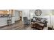 Open-concept living area with wood floors, a comfortable sofa, and an adjacent kitchen at 3145 E Flamingo Rd # 1045, Las Vegas, NV 89121