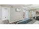 Main bedroom with ensuite bathroom access, ceiling fan, and large mirror-door closet at 3145 E Flamingo Rd # 1045, Las Vegas, NV 89121