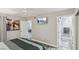 Spacious main bedroom featuring ceiling fan, wall-mounted TV, and ensuite bathroom at 3145 E Flamingo Rd # 1045, Las Vegas, NV 89121