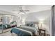 Cozy main bedroom with mirrored closet, ceiling fan, and contemporary design elements at 3145 E Flamingo Rd # 1045, Las Vegas, NV 89121