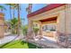 Covered outdoor kitchen and grill area with views of the community playground and green area at 3145 E Flamingo Rd # 1045, Las Vegas, NV 89121