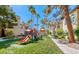 Charming community playground featuring colorful play equipment and lush green surroundings, perfect for Gathering fun at 3145 E Flamingo Rd # 1045, Las Vegas, NV 89121