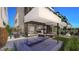 Luxurious outdoor living with a built-in spa, ample seating, dining area, and beautiful landscaping at 32 Heron Harbour Dr, Henderson, NV 89011