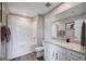 Bathroom with a shower-tub combination, framed mirror, and stylish vanity at 3358 Via Strada St, Henderson, NV 89044
