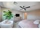 Bright bedroom with leafy plant, soft textiles, and lots of natural light at 3358 Via Strada St, Henderson, NV 89044