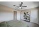 Well lit bedroom featuring plants on shelving and two closet doors at 3358 Via Strada St, Henderson, NV 89044