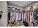 Walk-in closet with organized storage, hanging racks, and shelving for clothes and accessories at 3358 Via Strada St, Henderson, NV 89044