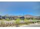 Street view of neighborhood homes, landscaping, and distant mountain backdrop at 3358 Via Strada St, Henderson, NV 89044
