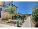 Community dog park features pet waste station, artificial turf, and landscaping creating a welcoming space for residents and their pets at 3358 Via Strada St, Henderson, NV 89044