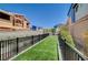 Artificial turf dog run with secure fencing ensures a clean and safe environment for pets to play freely at 3358 Via Strada St, Henderson, NV 89044