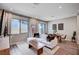 Inviting living room with a comfortable sofa, dining area, and modern decor at 3358 Via Strada St, Henderson, NV 89044