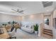 Inviting loft area with comfortable seating, a ceiling fan, and lots of natural light at 3358 Via Strada St, Henderson, NV 89044