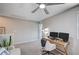 Open loft area featuring a ceiling fan, home office, and comfortable seating area at 3358 Via Strada St, Henderson, NV 89044