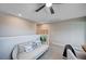 Cozy loft space with a ceiling fan, comfortable sofa, and versatile layout at 3358 Via Strada St, Henderson, NV 89044