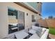 Back patio seating area with view into living room at 3358 Via Strada St, Henderson, NV 89044