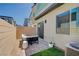 Outdoor patio featuring a lounge set and artificial grass at 3358 Via Strada St, Henderson, NV 89044