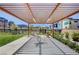 Under the shade of the pavilion, residents find seating and tables in a communal space for gatherings and relaxation at 3358 Via Strada St, Henderson, NV 89044