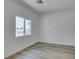 A clean bedroom with sleek flooring and natural light from a window at 383 N 16Th St, Las Vegas, NV 89101