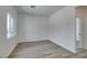 Bright bedroom with wood-look floors and a large window providing natural light at 383 N 16Th St, Las Vegas, NV 89101