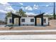 Charming duplex featuring a symmetrical design with clean white facade and yellow doors at 383 N 16Th St, Las Vegas, NV 89101