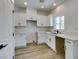 Bright kitchen features white cabinets, light countertops and recessed lighting at 383 N 16Th St, Las Vegas, NV 89101