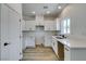 Bright kitchen featuring white cabinets, modern countertops, and sleek black hardware at 383 N 16Th St, Las Vegas, NV 89101
