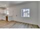 Bright open living area showcasing a partial kitchen setup and sleek flooring at 383 N 16Th St, Las Vegas, NV 89101