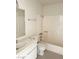 Bathroom featuring a vanity, mirror, tub, and a toilet at 4338 Caliente St # 12, Las Vegas, NV 89119