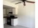 Efficient kitchen area with black appliances, ample cabinetry, and a convenient layout at 4338 Caliente St # 12, Las Vegas, NV 89119