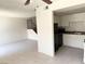 Open-concept living room flows into the kitchen area with tile floors, and easy access to the upper floor at 4338 Caliente St # 12, Las Vegas, NV 89119
