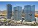 Complex featuring multiple modern residential towers, parking, landscaping, and roads at 4575 Dean Martin Dr # 1112, Las Vegas, NV 89103