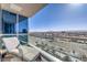 Relaxing condo balcony with seating and expansive city views at 4575 Dean Martin Dr # 1112, Las Vegas, NV 89103