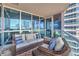 Balcony seating area with city views and a modern glass railing at 4575 Dean Martin Dr # 1112, Las Vegas, NV 89103