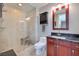 Bathroom with a walk-in shower with marble-style tile and updated vanity at 4575 Dean Martin Dr # 1112, Las Vegas, NV 89103