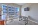 This bedroom is staged as an office with a desk, rolling chair, and city views at 4575 Dean Martin Dr # 1112, Las Vegas, NV 89103