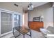 Cozy bedroom featuring a wooden dresser, a table, and expansive sliding glass doors to the balcony at 4575 Dean Martin Dr # 1112, Las Vegas, NV 89103