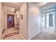Wide shot of the condo foyer with a wooden door, marble tile, and closet at 4575 Dean Martin Dr # 1112, Las Vegas, NV 89103