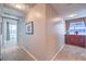 Bright hallway with neutral tones, carpeted flooring, and a glimpse of the city view from the window at 4575 Dean Martin Dr # 1112, Las Vegas, NV 89103