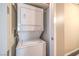 Stacked washer and dryer inside an alcove in the hallway at 4575 Dean Martin Dr # 1112, Las Vegas, NV 89103