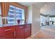 Stylish living space featuring a sleek bar area with stunning views of the city skyline at 4575 Dean Martin Dr # 1112, Las Vegas, NV 89103
