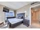 This is a warm main bedroom with a dark wooden bed frame and a television on the wall at 4575 Dean Martin Dr # 1112, Las Vegas, NV 89103