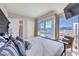 Comfortable main bedroom featuring floor-to-ceiling windows with amazing city views at 4575 Dean Martin Dr # 1112, Las Vegas, NV 89103