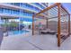 Condo pool area featuring a pergola, seating, lounge chairs, and tile flooring at 4575 Dean Martin Dr # 1112, Las Vegas, NV 89103