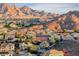 Stunning aerial view of a home nestled in a vibrant community with breathtaking mountain backdrops at 53 Precipice Ct, Henderson, NV 89002