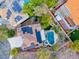 Aerial view of the property showcasing the pool, jacuzzi, solar panels, and landscaped backyard at 53 Precipice Ct, Henderson, NV 89002