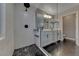 Contemporary bathroom showcasing stylish shower with dark tile flooring at 53 Precipice Ct, Henderson, NV 89002