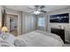 Cozy bedroom with a ceiling fan and a TV on the wall at 53 Precipice Ct, Henderson, NV 89002